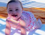 Alli is all smiles here in her bathing suit at the beach